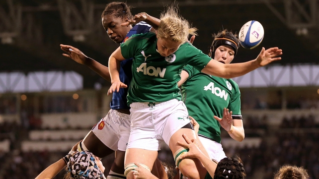 Claire Molloy and Marie Louise Reilly of Ireland compete with Coumba Diallo