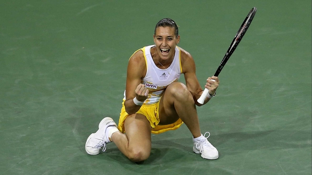 Flavia Pennetta celebrates after winning match point