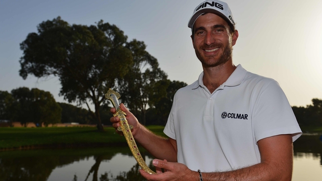 Alejandro Canizares holds the winner's trophy