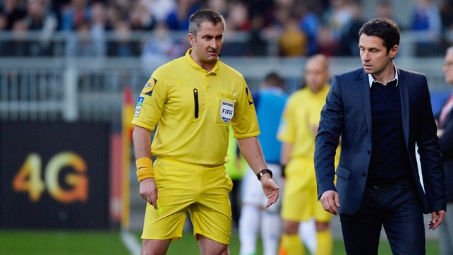 Referee Fredy Lautrel (left) and Lyon coach Remi Garde. Garde refused to comment on the goals, saying that he would risk suspension by doing so