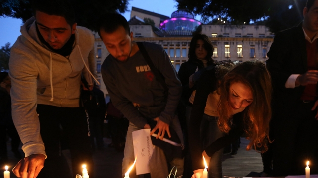 People take part in a candlelight vigil making the third anniversary of the Syrian uprising in Beirut People take part in a candlelight vigil making the third anniversary of the Syrian uprising in Beirut