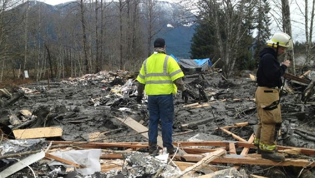 Emergency workers examine debris after a mudslide in Snohomish County, Washington Emergency workers examine debris after a mudslide in Snohomish County, Washington