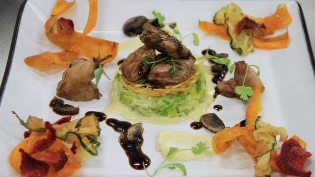 Pan fried quail with creamed leeks and parsnip puree with crispy vegetables, potato rosti and a por Pan fried quail with creamed leeks and parsnip puree with crispy vegetables, potato rosti and a por