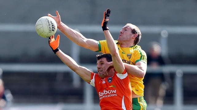Armagh's Stephen Harold and Donegal's Neil Gallagher battle for the ball
