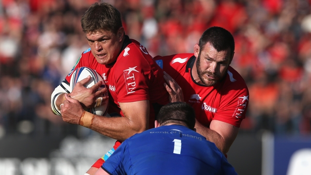Juan Smith of Toulon, with team-mate Danie Rossouw in support, takes on Cian Healy