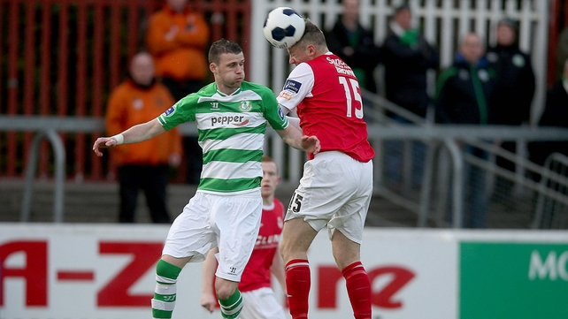 Ciaran Kilduff of Rovers is beaten to the high ball by Kenny Browne of Pat's