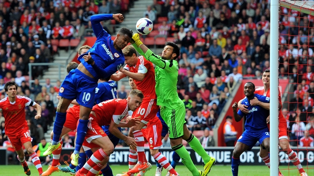 Saints 'keeper Paulo Gazzaniga clears his lines despite Fraizer Campbell's best efforts