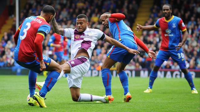 Villa's Ryan Bertrand battles for posession with Adrian Mariappa and Jason Puncheon as Cameron Jerome looks on
