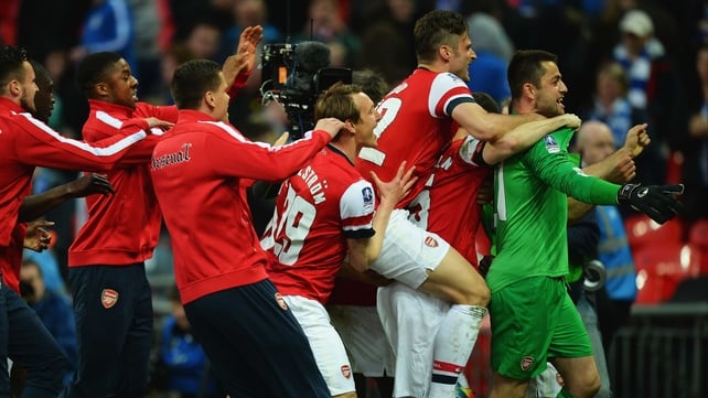 Lukasz Fabianski is mobbed at the end