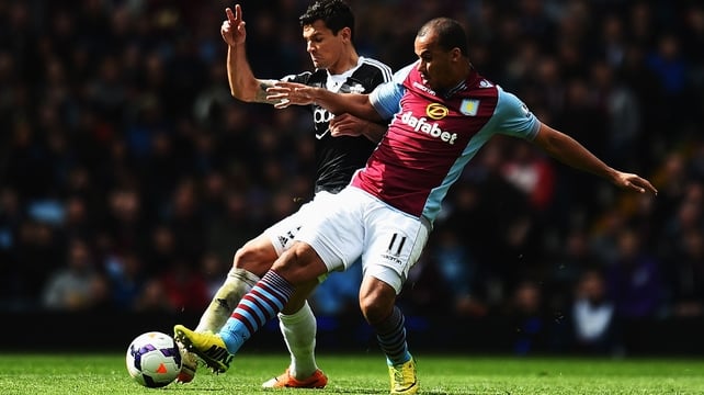 Dejan Lovren of Southampton (L) is challenged by Gabriel Agbonlahor of Aston Villa