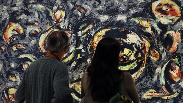 Visitors look at an authentic untitled work by US artist Jackson Pollock belonging to the Guggenheim foundation Visitors look at an authentic untitled work by US artist Jackson Pollock belonging to the Guggenheim foundation
