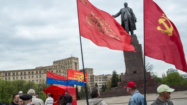 A small group of pro-Russians gather below a statue of Vladimir Lenin in Kharkiv, Ukraine A small group of pro-Russians gather below a statue of Vladimir Lenin in Kharkiv, Ukraine
