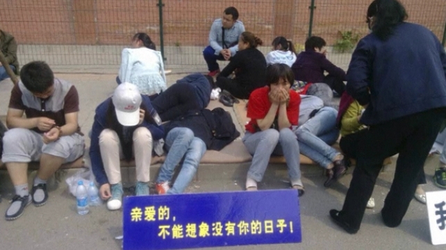 The protest followed a chaotic meeting yesterday between airline staff and relatives The protest followed a chaotic meeting yesterday between airline staff and relatives