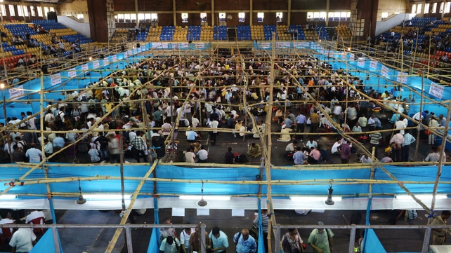 Indian election officials distribute electronic voting machines to polling officials Indian election officials distribute electronic voting machines to polling officials
