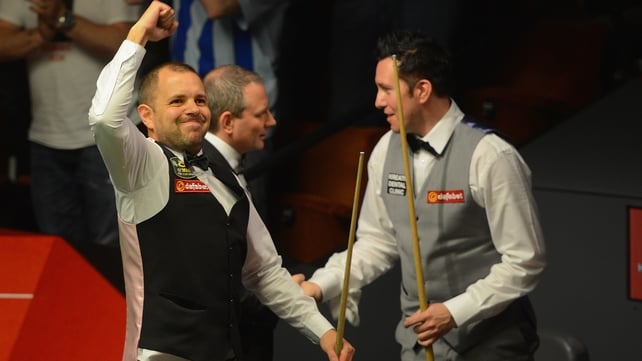 Barry Hawkins celebrates his narrow victory over Dominic Dale