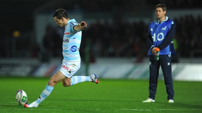 Ronan O'Gara watches on in his role as Racing Metro coach, as his former playing rival Johnny Sexton, kicks at goal