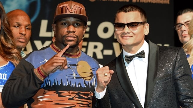 WBC welterweight champion Floyd Mayweather Jr and and WBA champion Marcos Maidana pose at the MGM Grand ahead of Saturday night's world title fight