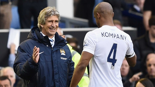 Manuel Pellegrini congratulates captain Vincent Kompany after the match