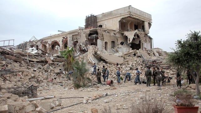 Syrian government forces sift through the rubble following the explosion Syrian government forces sift through the rubble following the explosion