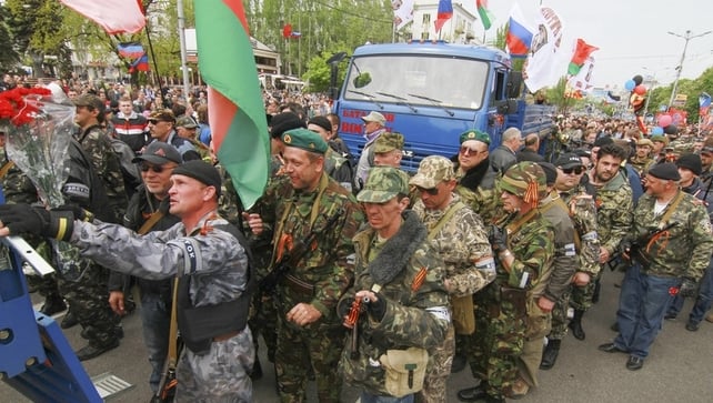 Armed supporters of the self-declared Donetsk People's Republic depart for Mariupol to help to separatists fighting with Ukrainian National Guard forces Armed supporters of the self-declared Donetsk People's Republic depart for Mariupol to help to separatists fighting with Ukrainian National Guard forces