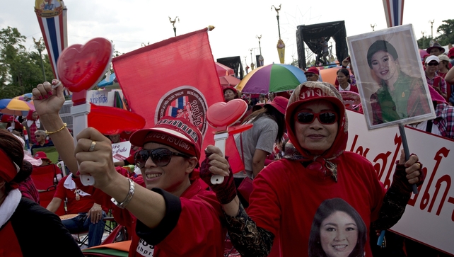 Thai pro-government 'Red Shirts' protesters hold portraits of ousted Thai prime minister Yingluck Shinawatra as they rally in Bangkok Thai pro-government 'Red Shirts' protesters hold portraits of ousted Thai prime minister Yingluck Shinawatra as they rally in Bangkok
