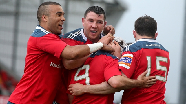 Munster's Duncan Williams (number 9) is congratulated for his try by Felix Jones, Simon Zebo and Paddy Butler