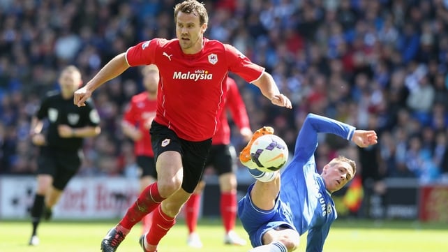 Fernando Torres is challenged by Ben Turner