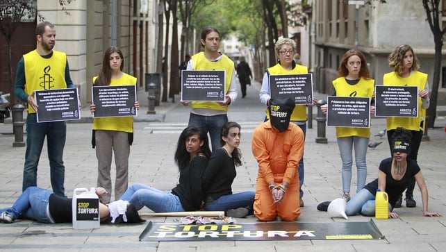 Members of Amnesty International take part in a 'Stop Torture' campaign rally in Barcelona, Spain Members of Amnesty International take part in a 'Stop Torture' campaign rally in Barcelona, Spain