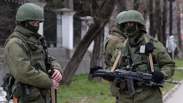 Russian soldiers patrol outside the navy headquarters in Simferopol on the Crimean peninsula in recent month Russian soldiers patrol outside the navy headquarters in Simferopol on the Crimean peninsula in recent month