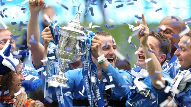 St Johnstone captain David Mackay lifts the prize
