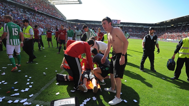 An injured Osasuns fan is attended after a barrier collapsed during the La Liga match between Osasuna and Real Betis