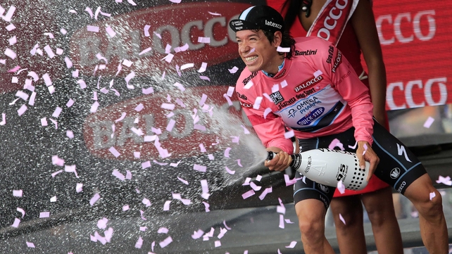 Rigoberto Uran celebrates taking the pink jersey