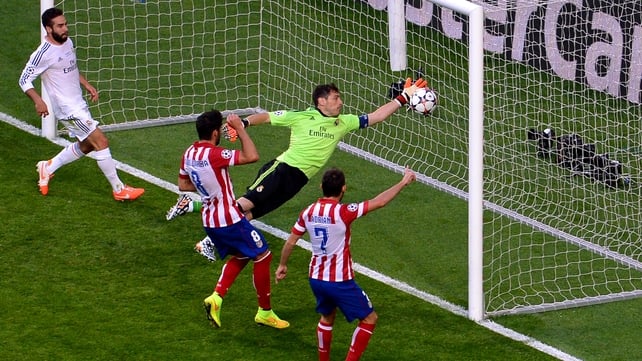 Real Madrid's Iker Casillas fails to stop Diego Godin's header