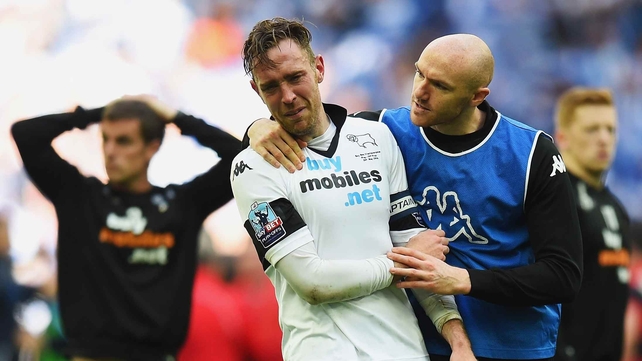 Richard Keogh is consoled by fellow Irish international Conor Sammon