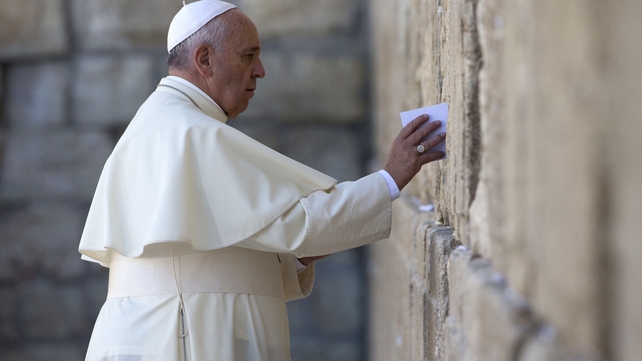 Pope Francis leaves a card at the Western Wall in Jerusalem's Old City Pope Francis leaves a card at the Western Wall in Jerusalem's Old City