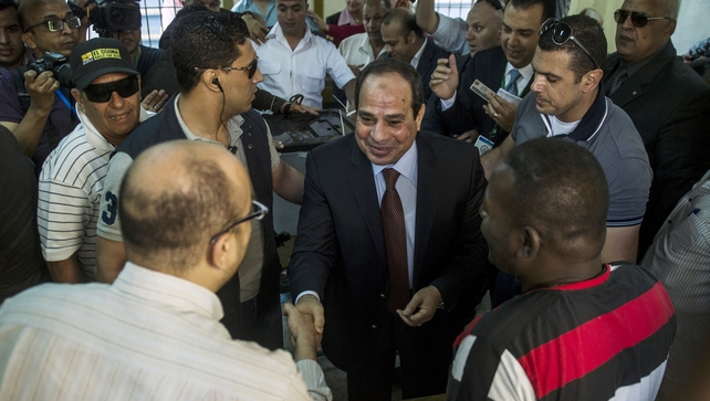 Egypt's ex-army chief and leading presidential candidate Abdel Fattah al-Sisi (Centre) arrives to vote in Cairo Egypt's ex-army chief and leading presidential candidate Abdel Fattah al-Sisi (Centre) arrives to vote in Cairo