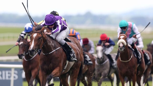 Ryan Moore on Marvellous gets ahead of Harry Bentley in the yellow and black silks on Lightning Thunder