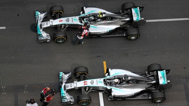 Lewis Hamilton's and Nico Rosberg's Mercedes cars sit side-by-side after the Monaco Grand Prix