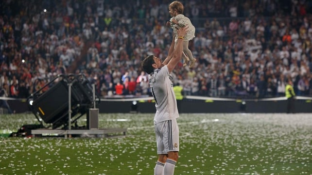 Gareth Bale celebrates his Champions League win with his daughter