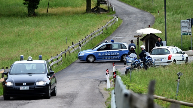 Italian police close a road following an accident near Germany's training camp in San Martino