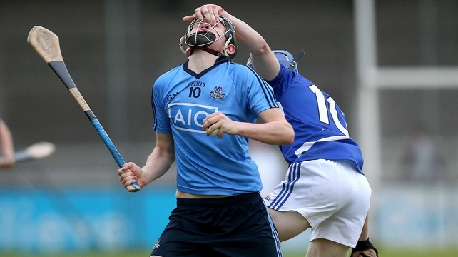 Dublin's Paul Winters has his helmet grabbed by Joe Campion of Laois