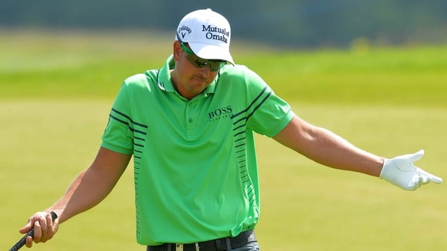 Henrik Stenson reacts after holing out for an eagle at the seventh