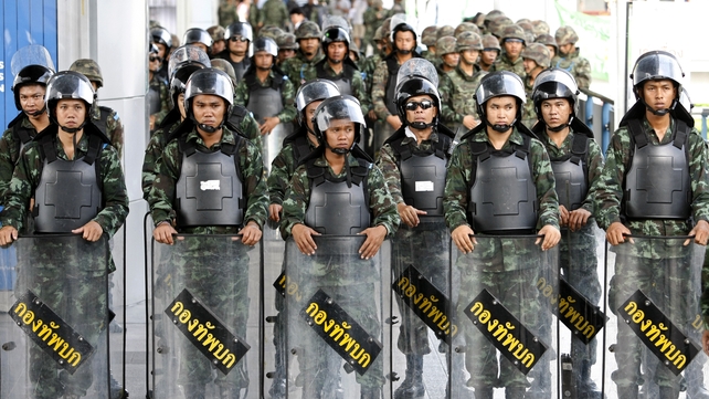 Thai soldiers prevent an anti-coup protest rally at a shopping district in Bangkok Thai soldiers prevent an anti-coup protest rally at a shopping district in Bangkok