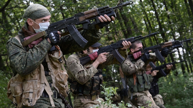 Pro-Russian militants participate in a military exercise at their training base near Donetsk Pro-Russian militants participate in a military exercise at their training base near Donetsk