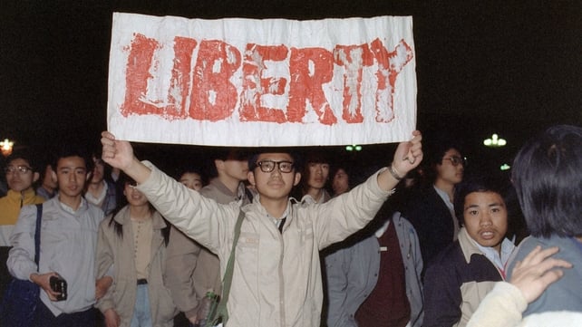 A student displays a banner with one of the slogans chanted by the crowd of some 200,000 pouring into Tiananmen Square 22 April 1989 A student displays a banner with one of the slogans chanted by the crowd of some 200,000 pouring into Tiananmen Square 22 April 1989