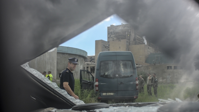 Police inspect damaged near the power plant after the explosion Police inspect damaged near the power plant after the explosion