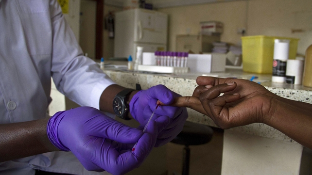 A lab technician draws blood from a patient for HIV testing at the Aids Information Centre in Kampala A lab technician draws blood from a patient for HIV testing at the Aids Information Centre in Kampala