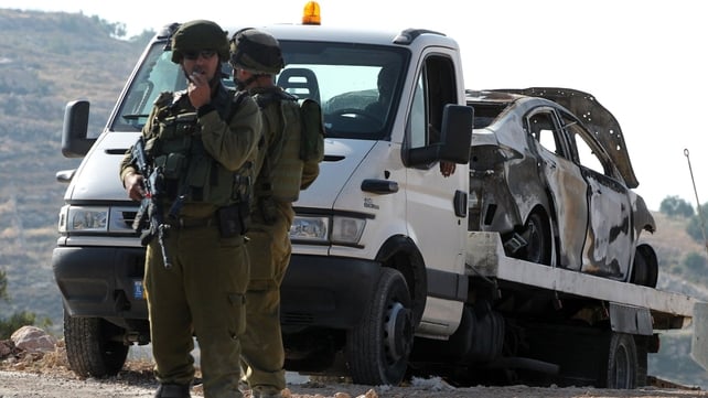 Israeli soldiers secure the area around a burnt car reportedly connected to the disappearance of three Israeli teen settlers Israeli soldiers secure the area around a burnt car reportedly connected to the disappearance of three Israeli teen settlers