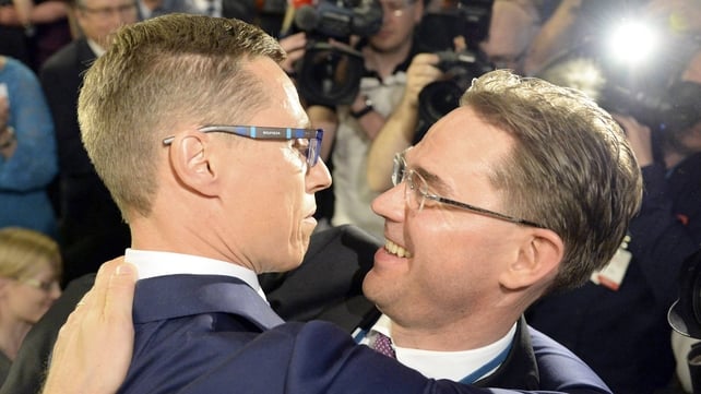 Alexander Stubb (L), new chairman of Finland's National Coalition party, is hugged by his predecessor Jyrki Katainen (R) after his election in the party's congress Alexander Stubb (L), new chairman of Finland's National Coalition party, is hugged by his predecessor Jyrki Katainen (R) after his election in the party's congress