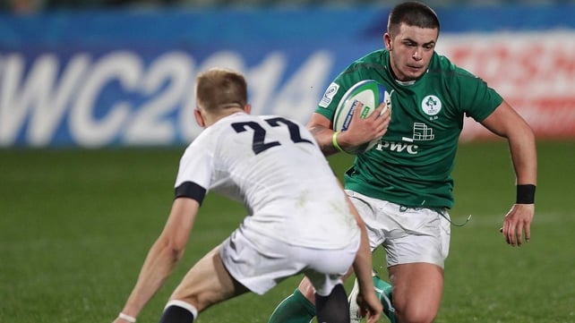 Ireland's Ryan Foley is tackled by Sam Olver of England
